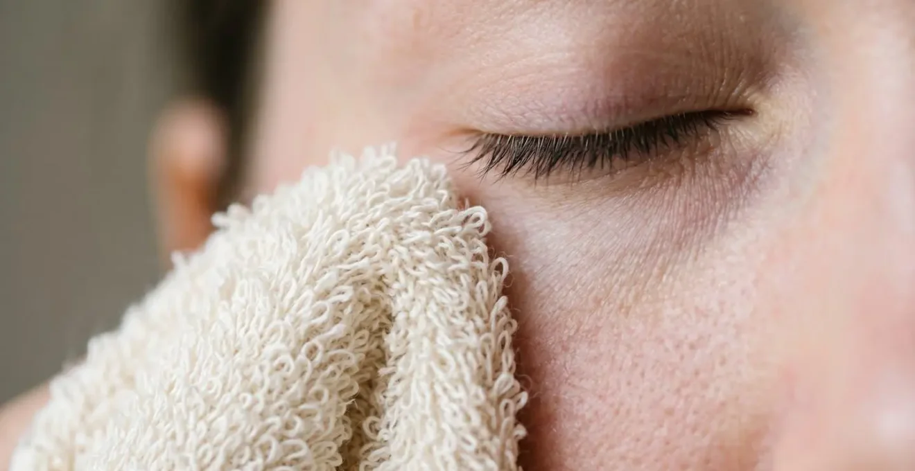 Macro detail of gentle eye cleansing motion showing proper technique without skin dragging